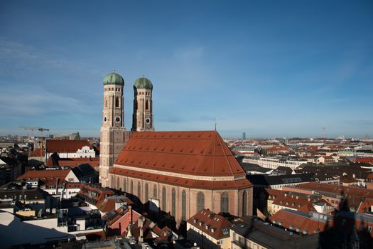 Scenic aerial shot of the iconic Frauenkirche surrounded by Munich cityscape.