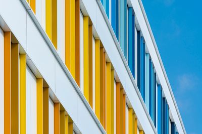 Brightly striped building facade, photo by Jan van der Wolf on Pexels
