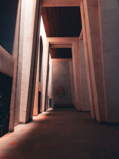 Free Discover the serene elegance of this majestic basilica corridor with high columns. Stock Photo