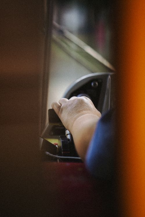 Free Close-up view of a man's hand steering a vehicle, captured in Halberstadt, Germany. Stock Photo