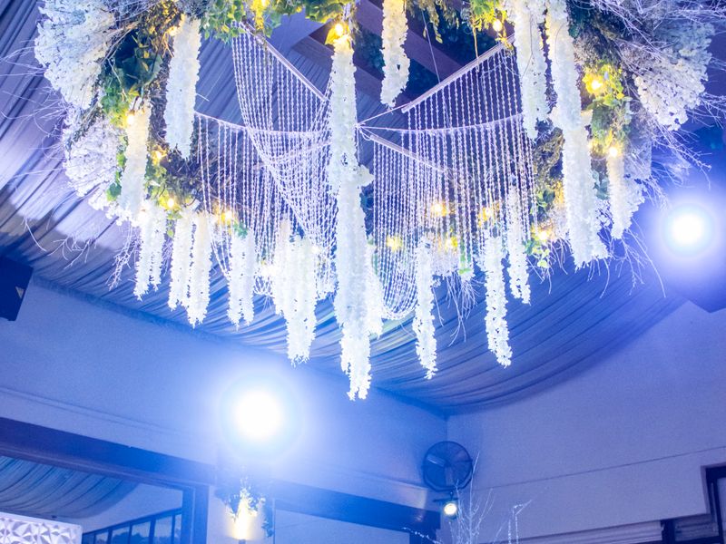 Venue with illuminated floral ceiling installation
