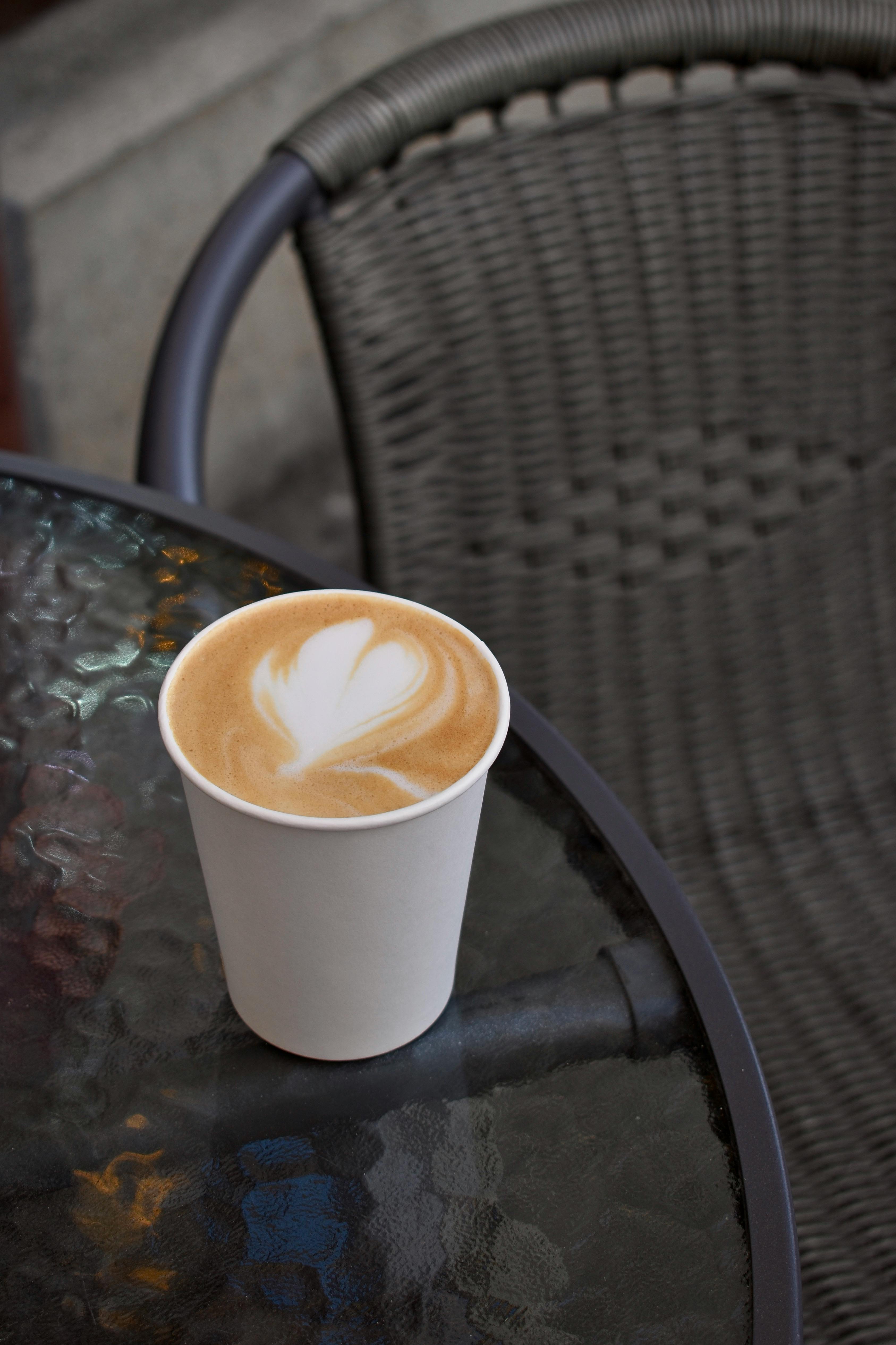 Cappuccino in Paper Cup on Table · Free Stock Photo