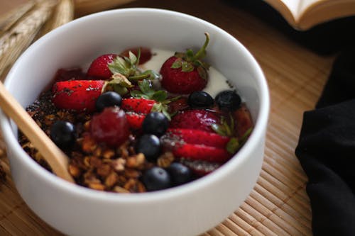Free Bowl of Granola with Whole Fruits Stock Photo