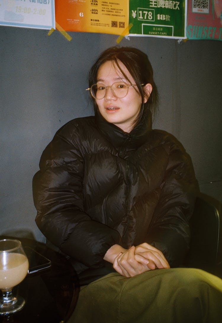 Brunette Woman In Black Puffer Jacket