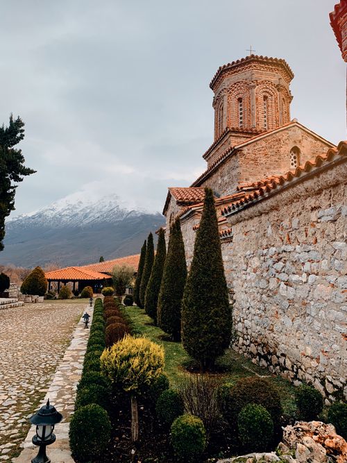 Free Scenic view of Saint Naum Monastery with mountains in Ohrid, North Macedonia. Stock Photo