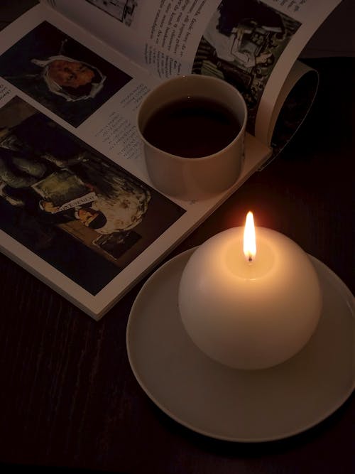 Magazine and Coffee in Candlelight