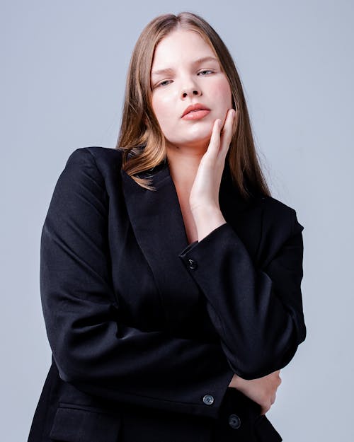Model in Black Blazer on White Background