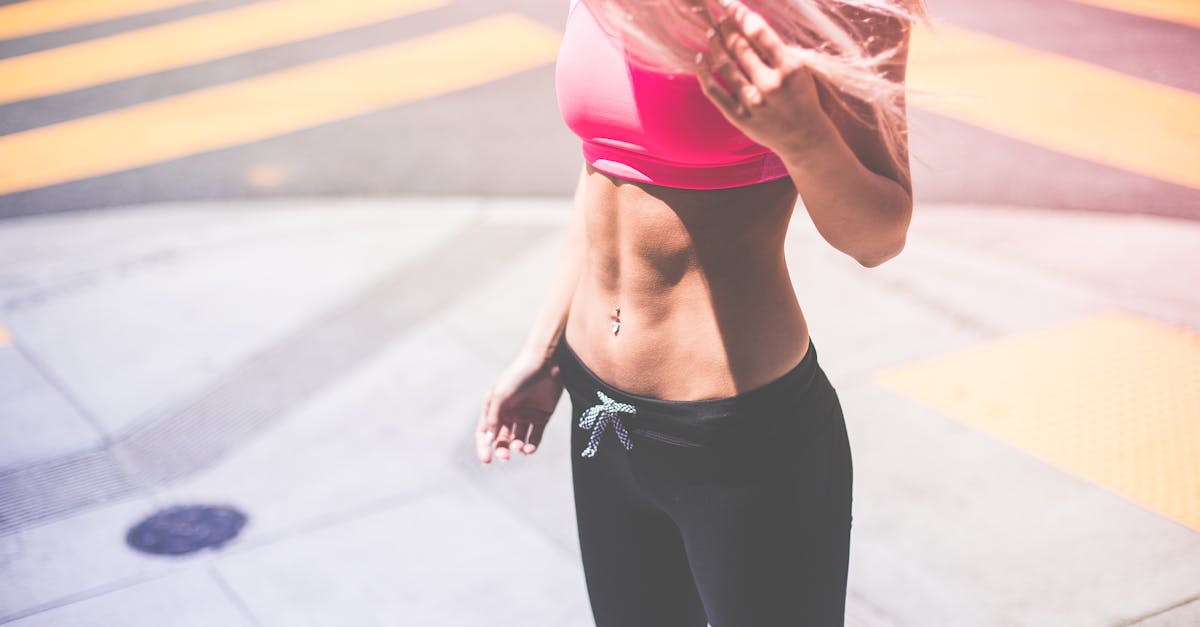 The Best Foods to Eat Depending on What Kind of Cramps You Have 6 Woman Wearing Pink Sports Bra and Black Draw String Pants · Free Stock Photo