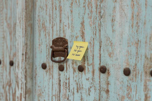 Sticky Note on a Wooden Door 