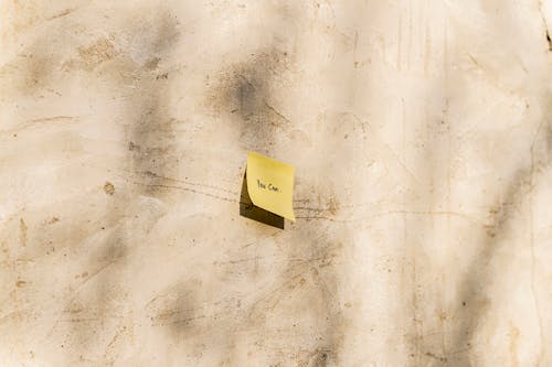 Sticky Note on a Wall in Sunlight 