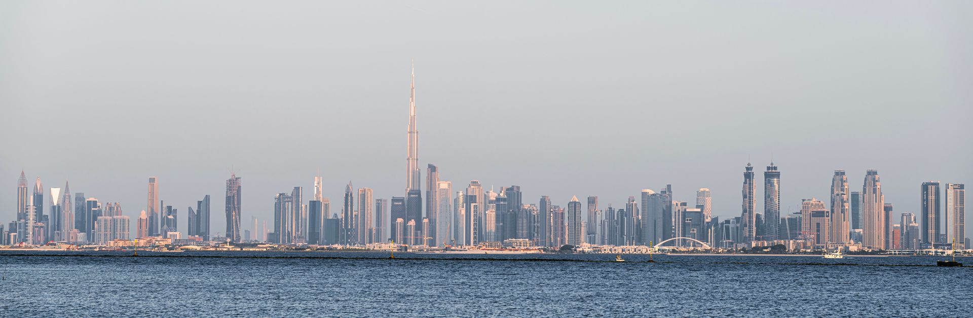 A stunning view of Dubai's skyline featuring Burj Khalifa across the sea.