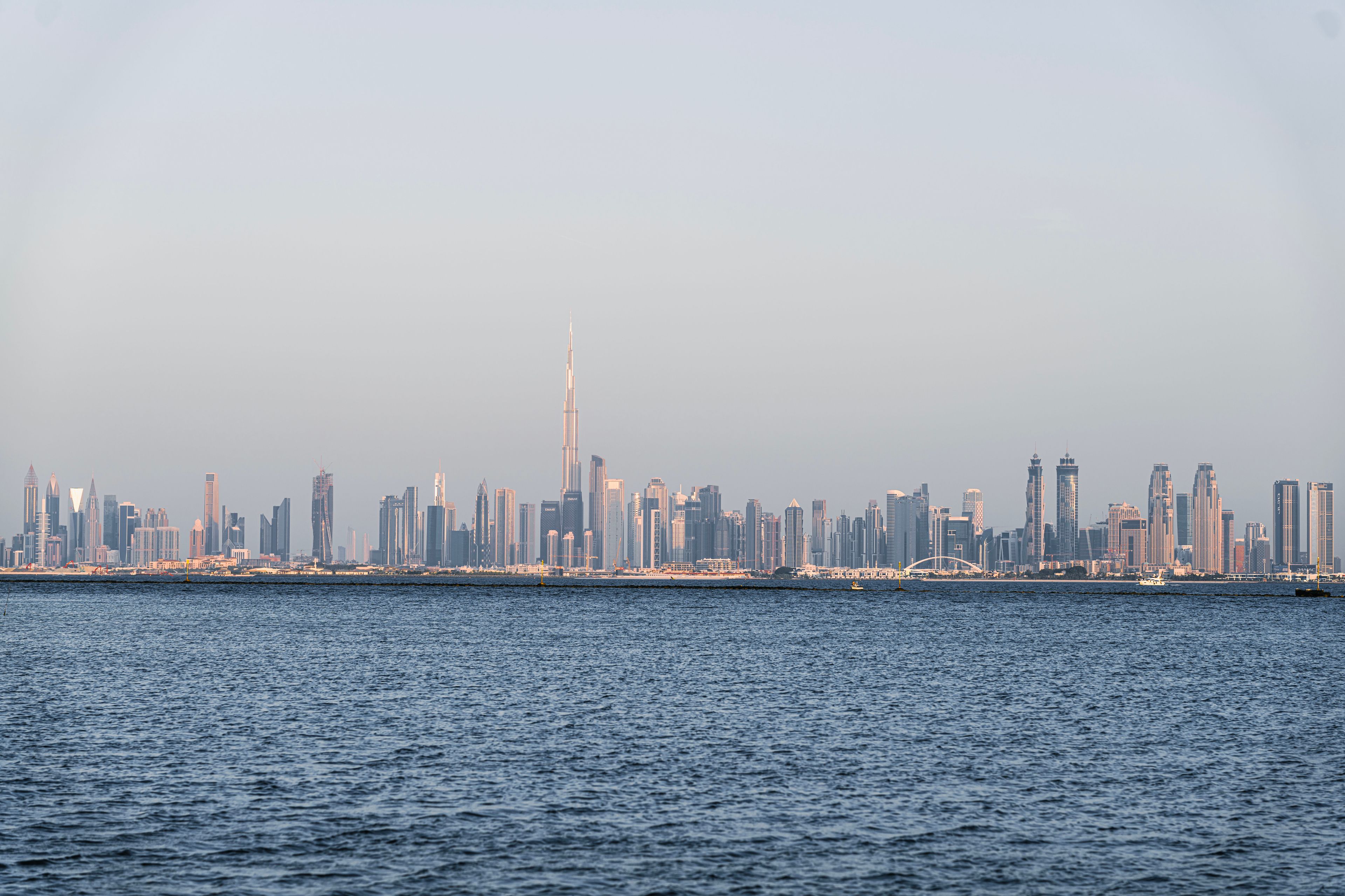 A stunning view of Dubai's skyline featuring Burj Khalifa across the sea.