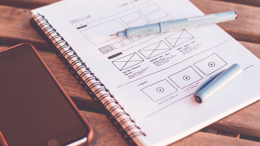 A website layout being sketched and designed