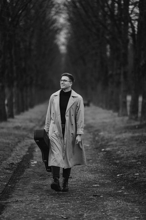 Man Wearing Coat in a Forest in Black and White 