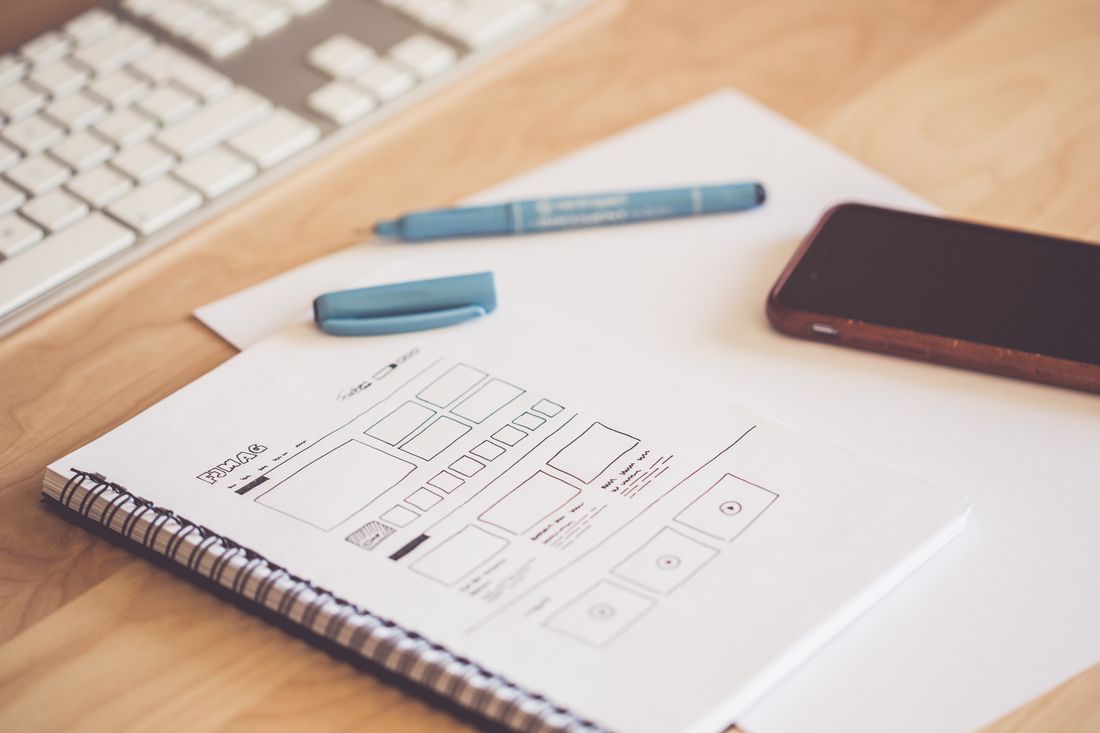 notebook wireframe sketches with pen