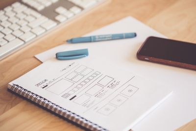 Hand-drawn interface wireframes in a sketchbook — photo by picjumbo.com on Pexels