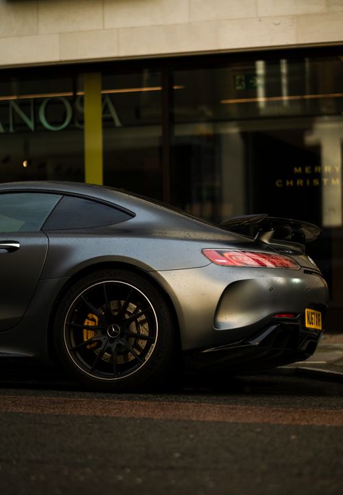 Free Capture of a Mercedes-AMG GT R on a dim London street, showcasing urban elegance. Stock Photo