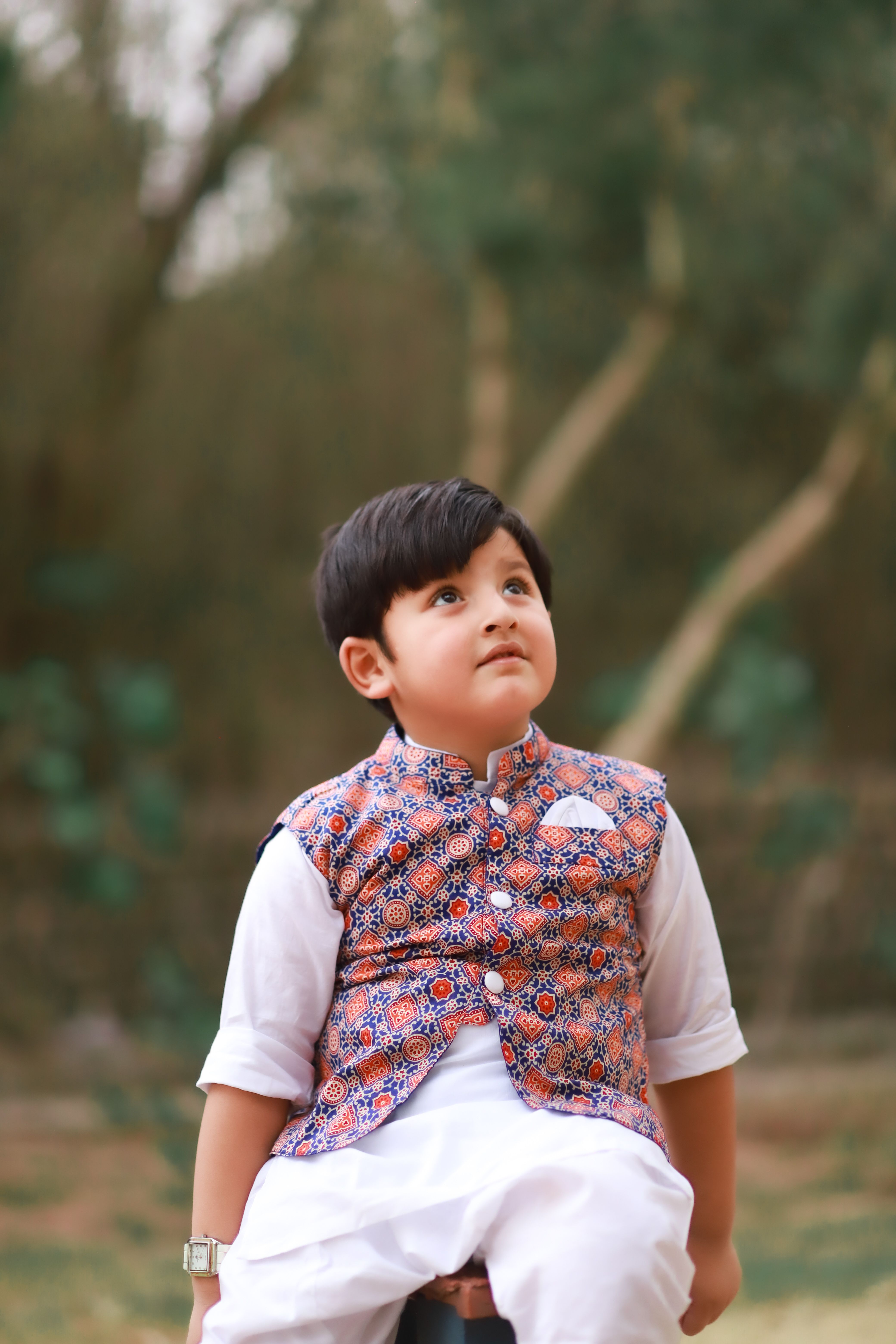 Boy in Vest Looking Up · Free Stock Photo