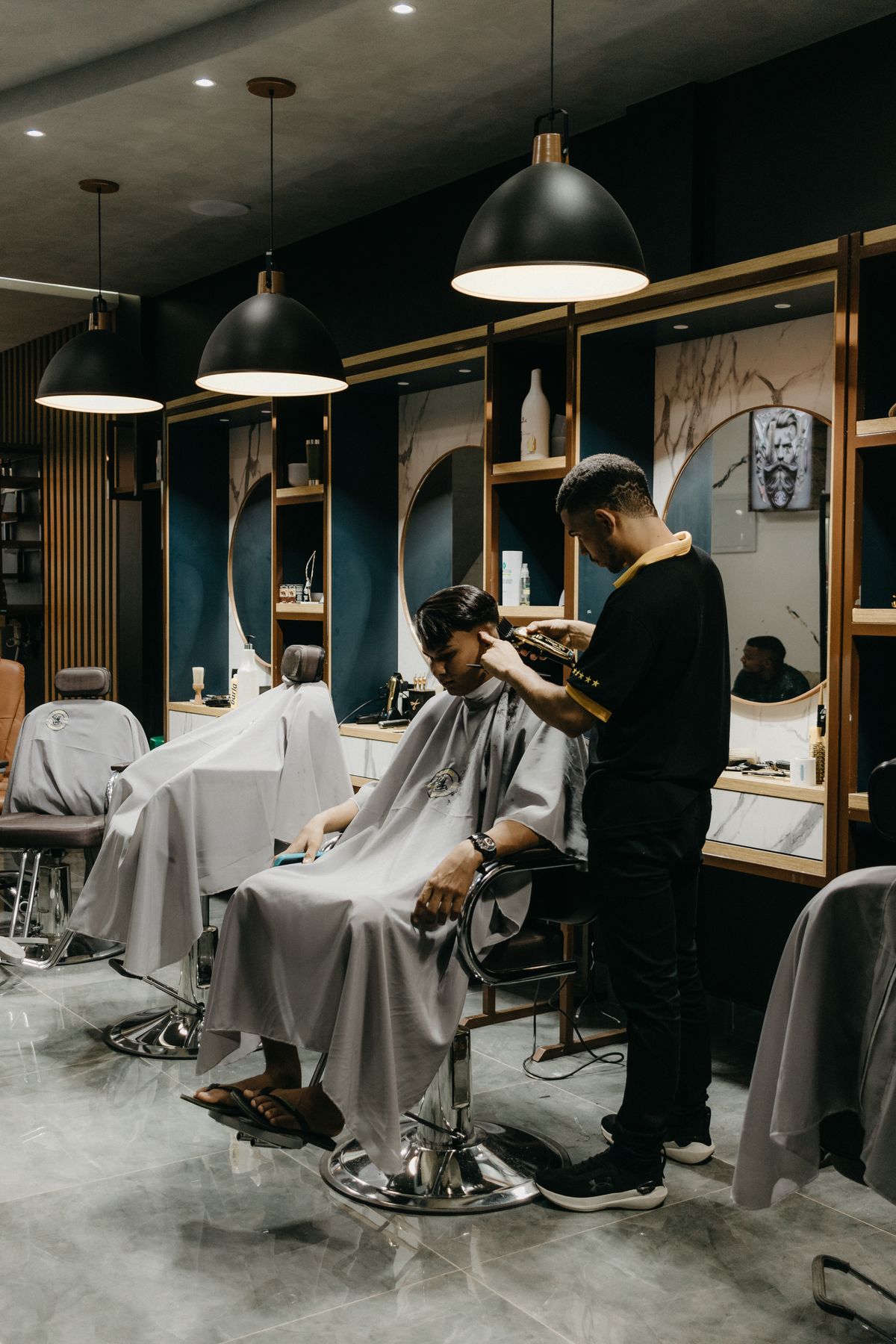 Barber giving a client a precise haircut