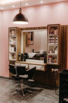 Stylish barber shop with sleek furniture and ambient lighting for a contemporary grooming experience.