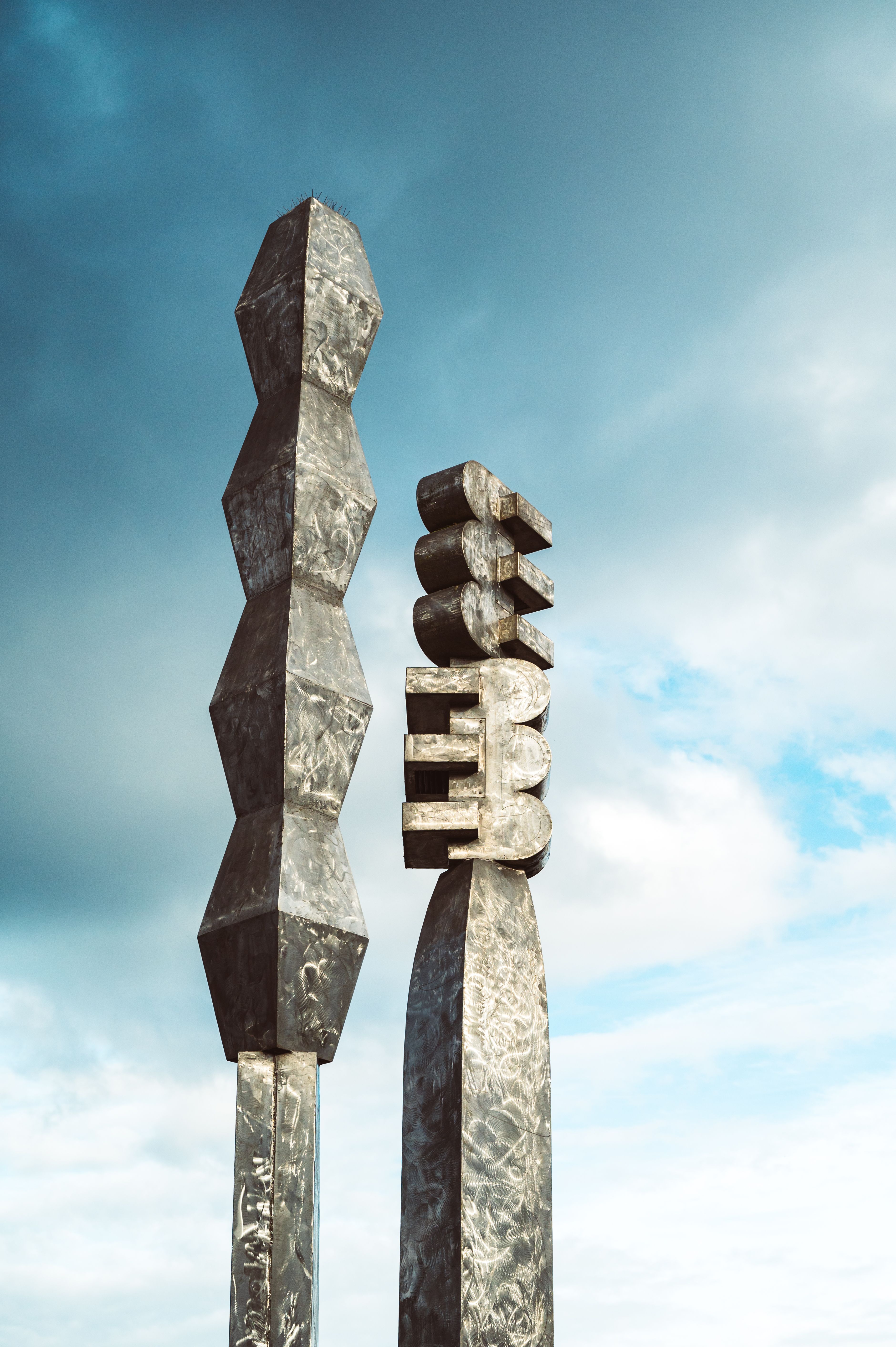 Brutalist concrete monument against sky