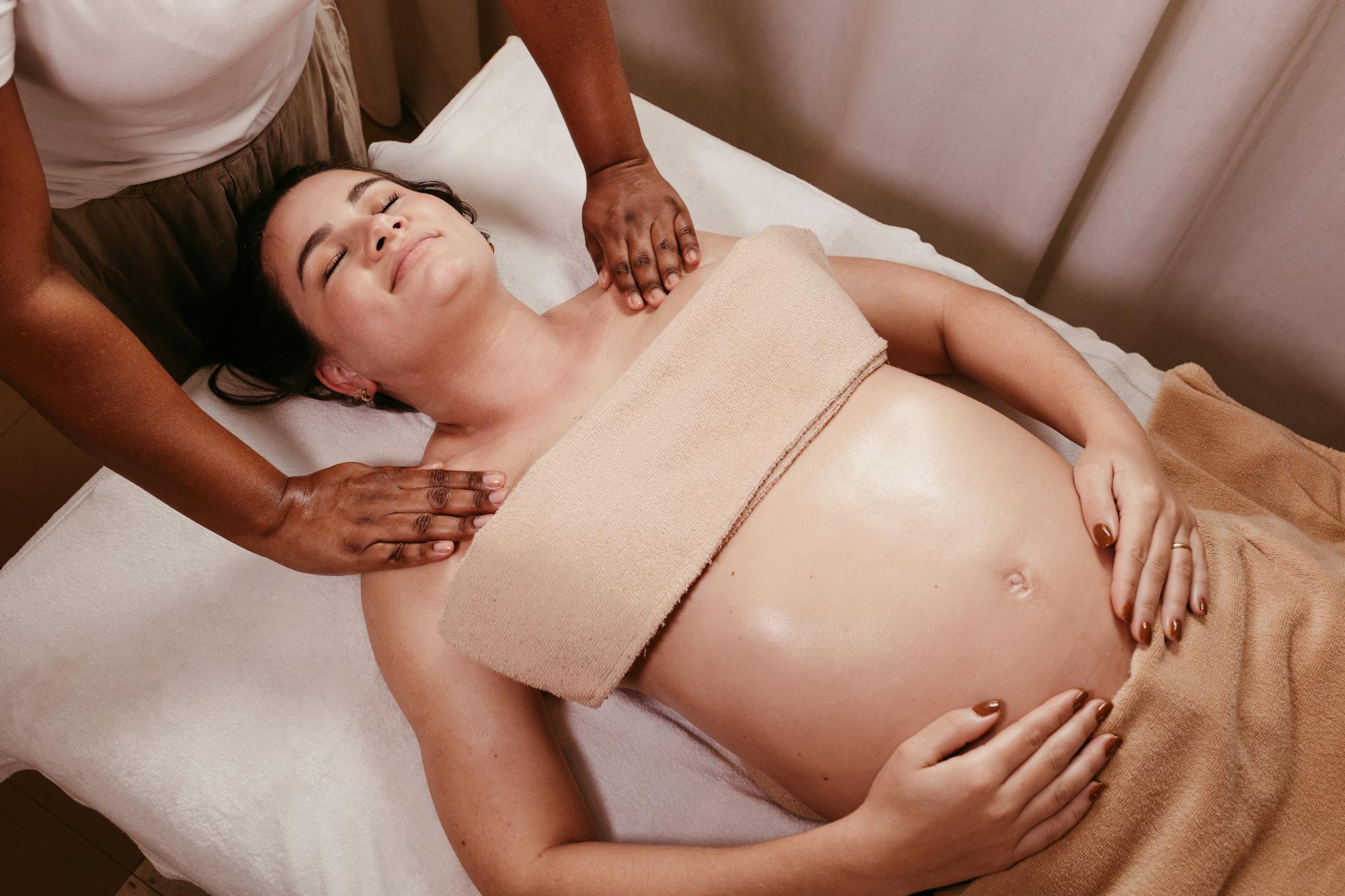 Pregnant woman enjoying a soothing prenatal massage in a spa. Relaxation and pampering at its best.