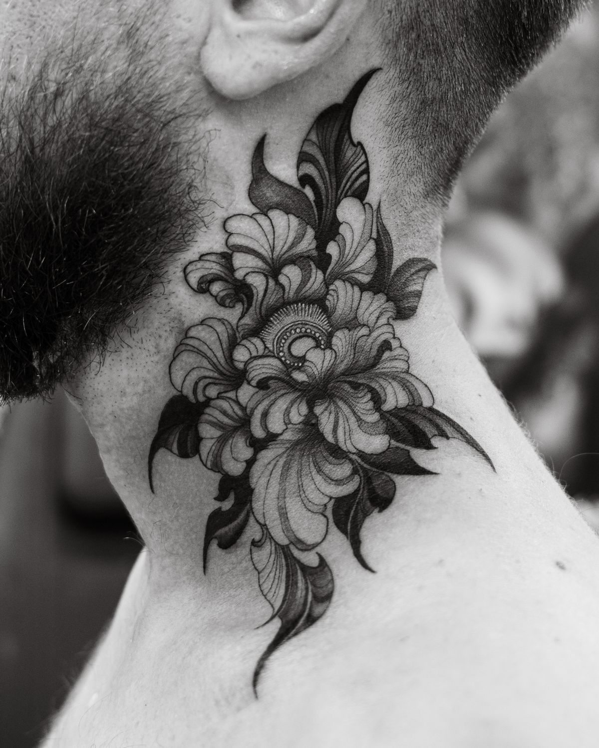 Black and grey floral neck tattoo