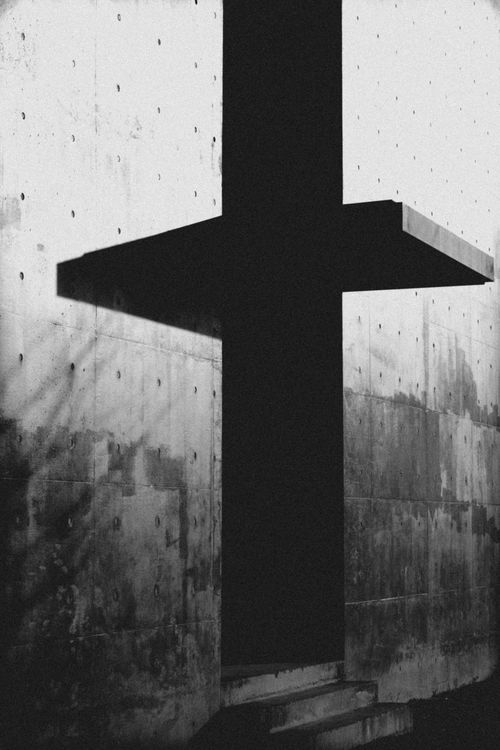 Free Black and white concrete wall with a cross shadow pattern in city environment. Stock Photo