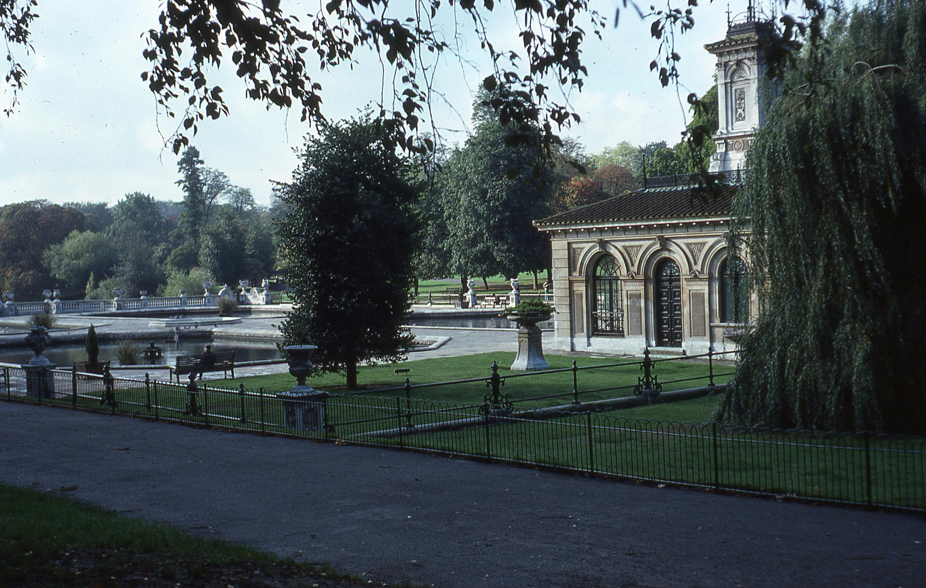 View of the Italian Gardens in Hyde Park, London, featuring lush greenery and classical architecture.