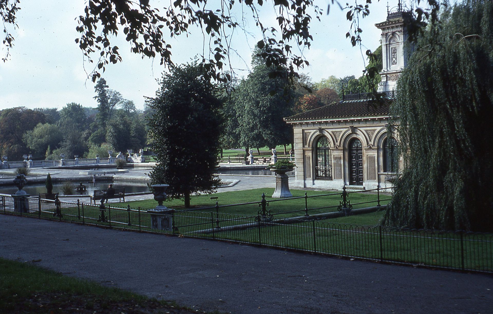 View of the Italian Gardens in Hyde Park, London, featuring lush greenery and classical architecture.