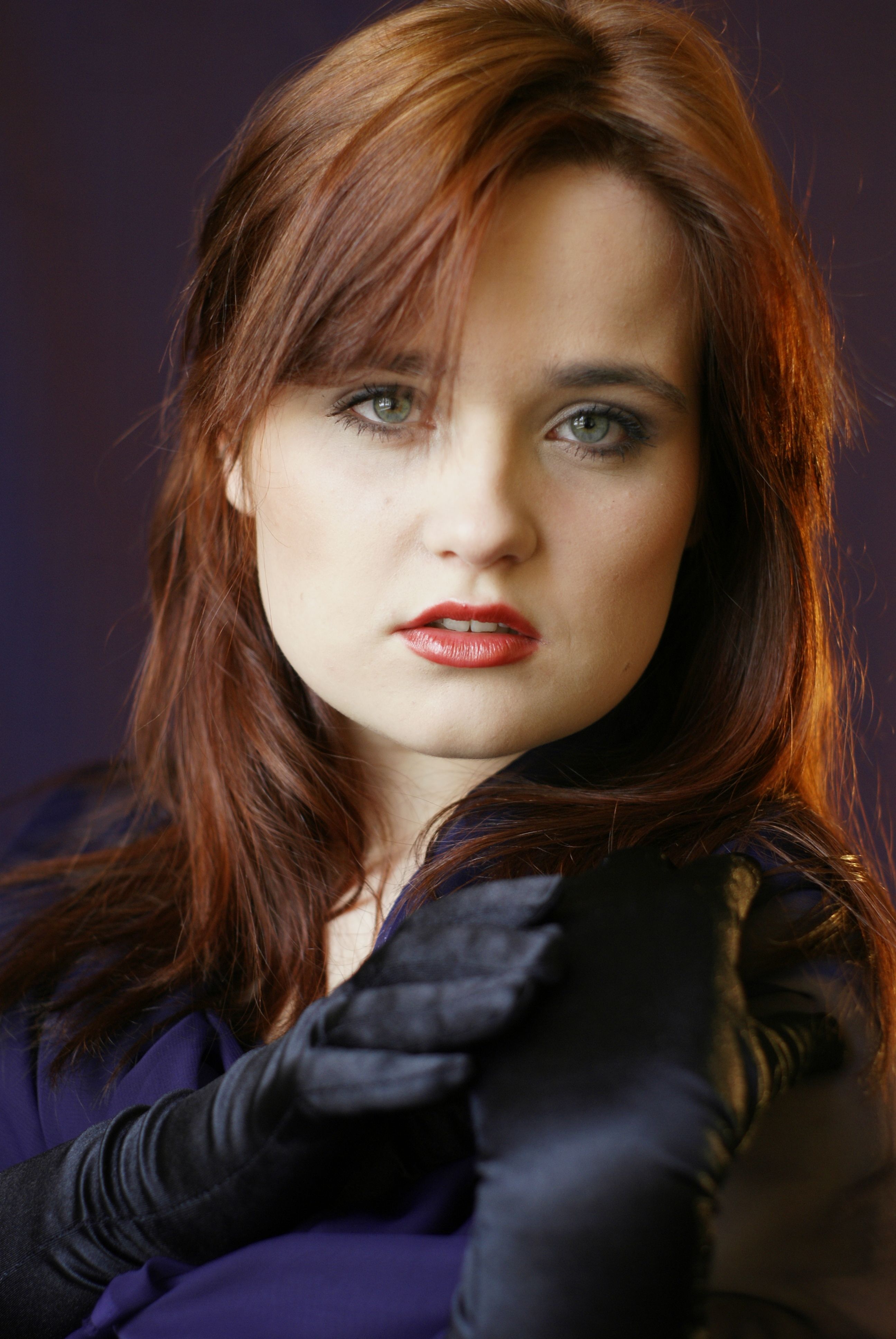 A woman with red hair and black gloves · Free Stock Photo