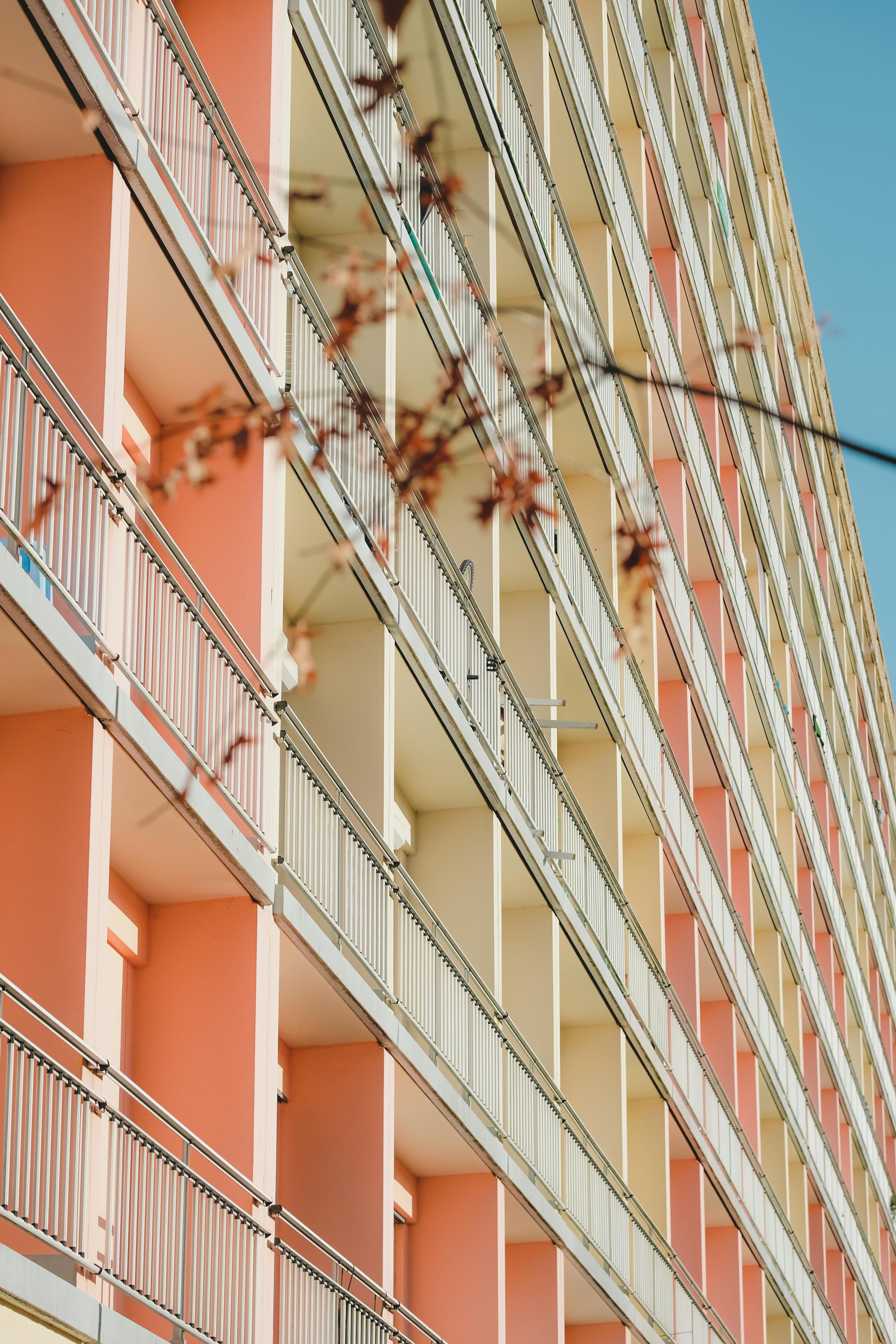 Vertical shot of a vibrant apartment building facade in Rennes, Brittany, France.