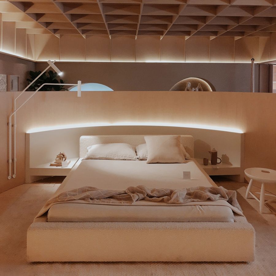 Made bed with layered linens in a modern bedroom — photo by tiago alves on Pexels