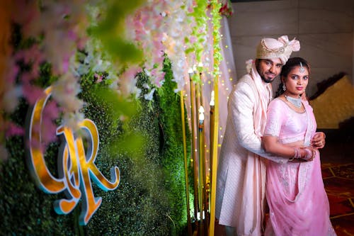 Embracing Newlyweds in Traditional Clothing