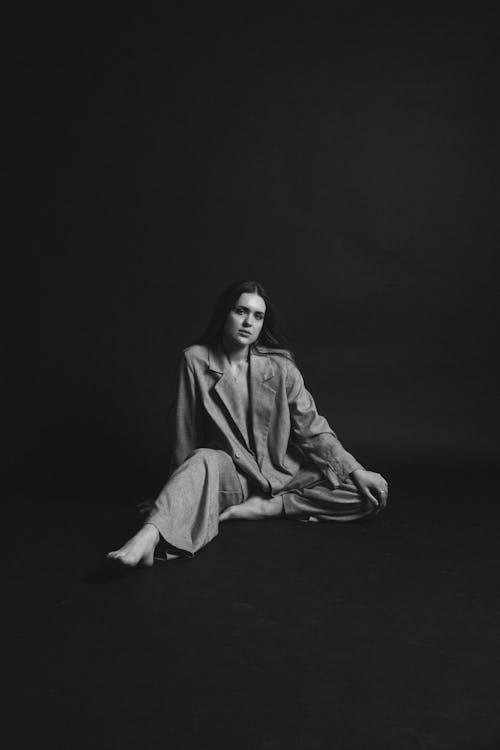 Woman Posing in Suit in Black and White