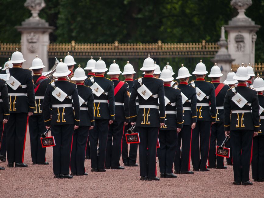 Ceremonial soldiers in traditional uniform back view at London's Buckingham Palace.