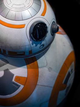 Detailed close-up of a spherical robot with orange and white design.