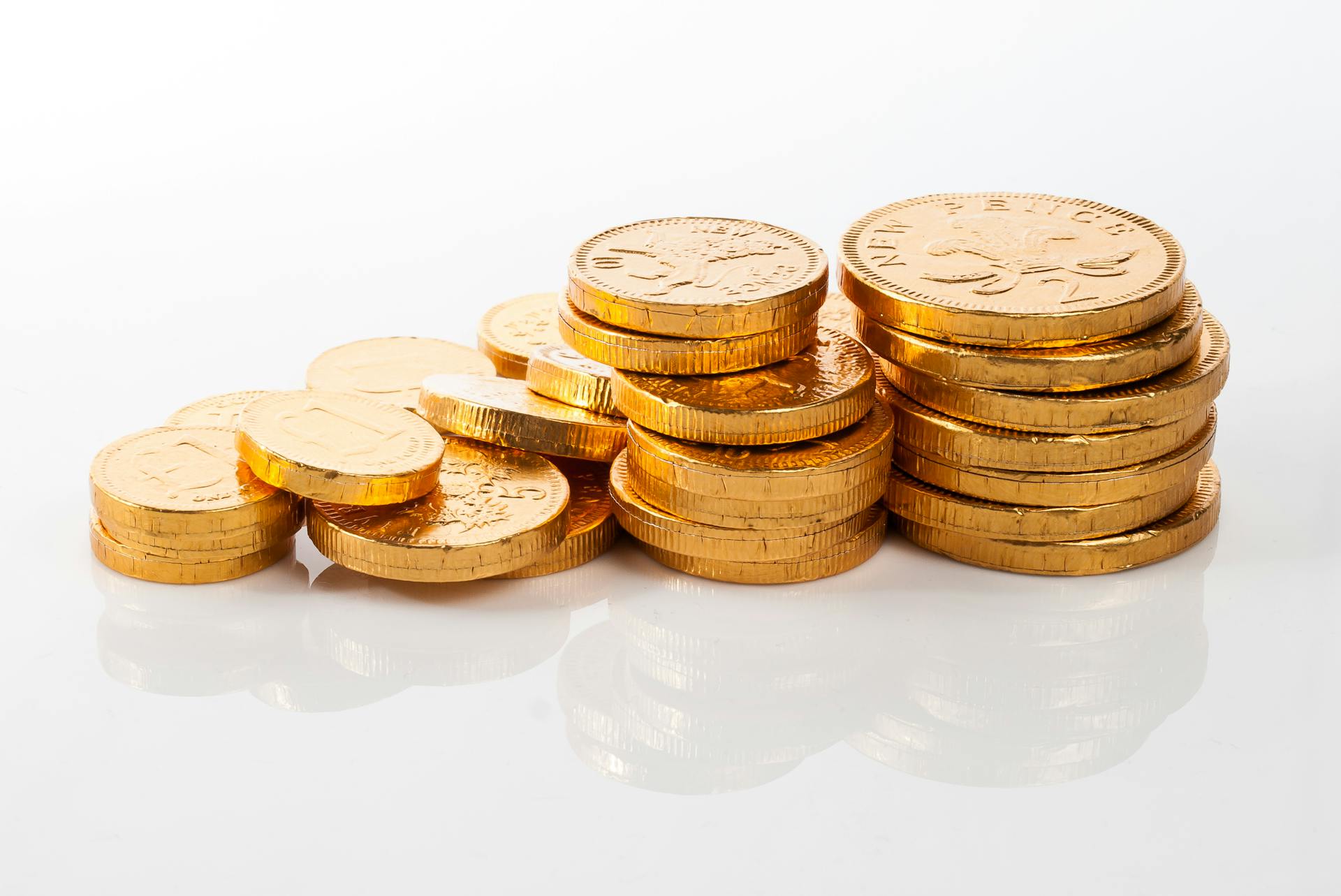 Image of stacked golden coins symbolizing wealth and prosperity.