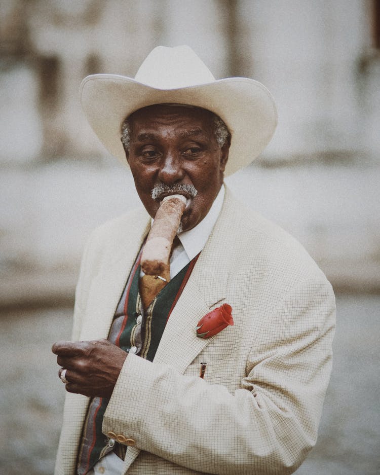 Elegant Elderly Man Smoking A Cigar 