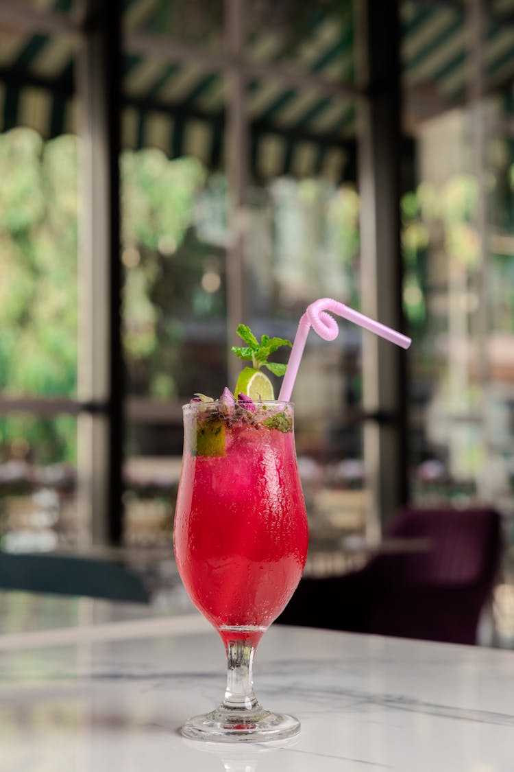 Red Cocktail Served In A Bar 