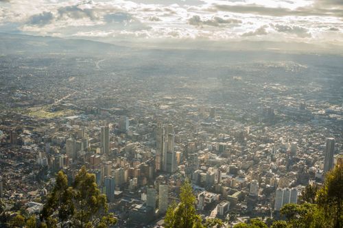 Free Stunning aerial view of Bogotá's urban landscape under a cloudy sky. Stock Photo