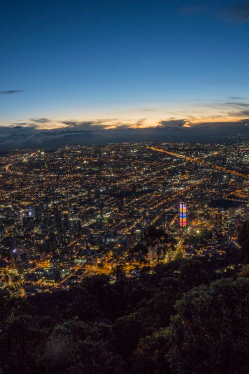 Free Stunning aerial view of Bogotá at night showcasing illuminated urban landscape and skyline. Stock Photo