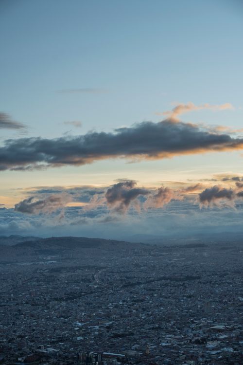 Free A breathtaking panoramic view of Bogotá, Colombia, with dramatic clouds during sunset. Stock Photo