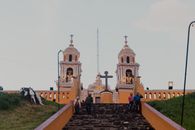 Stunning view of the Nuestra Señora de los Remedios Church atop ancient pyramid in Puebla, Mexico.
