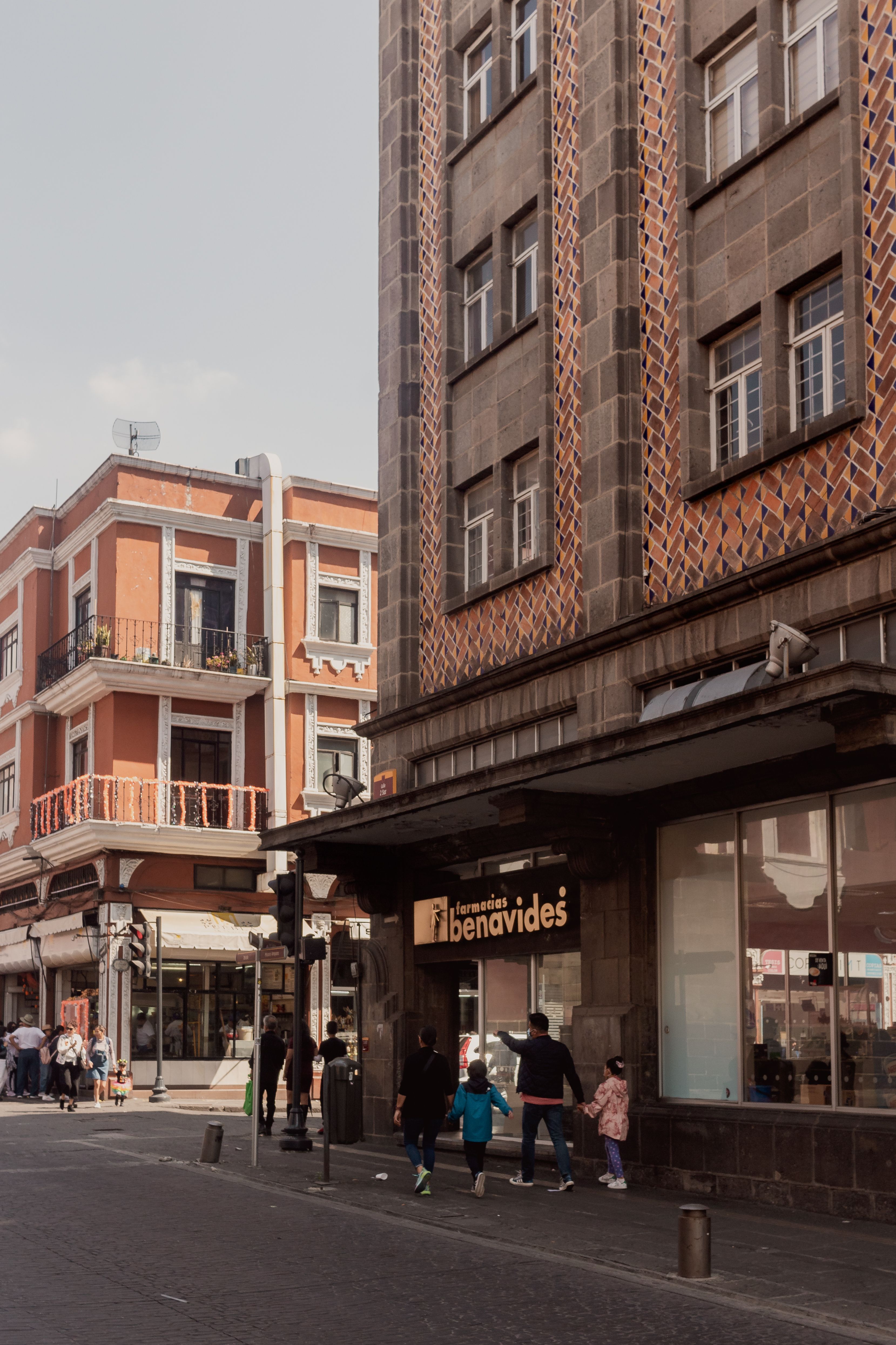 Charming street scene in Heroica Puebla de Zaragoza showcasing urban architecture and city life.