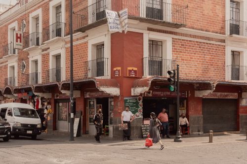Free Bustling urban street scene showcasing architectural charm in Heroica Puebla de Zaragoza, Mexico. Stock Photo