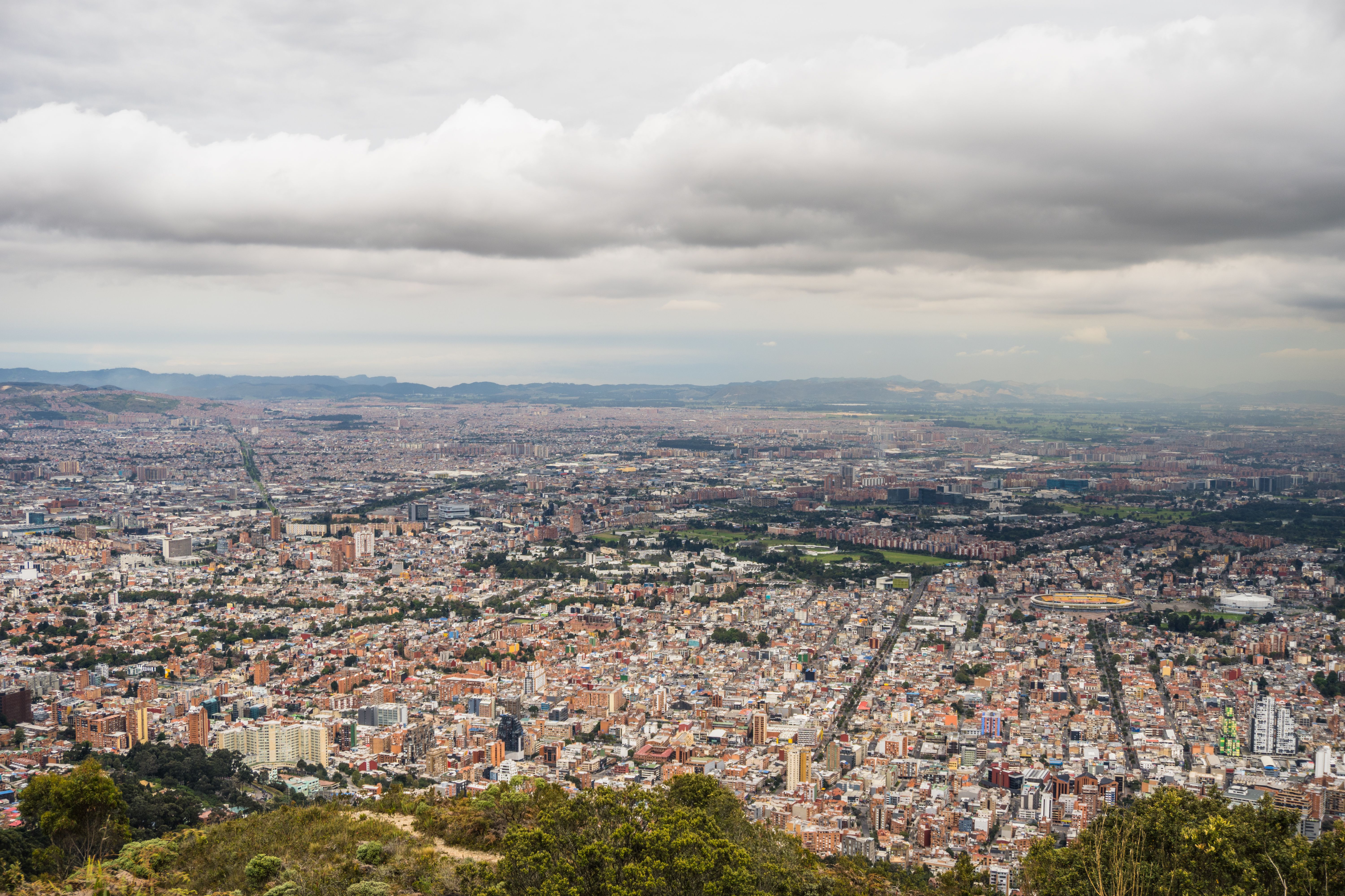 Aerial View of a Large City under a Cloudy Sky · Free Stock Photo