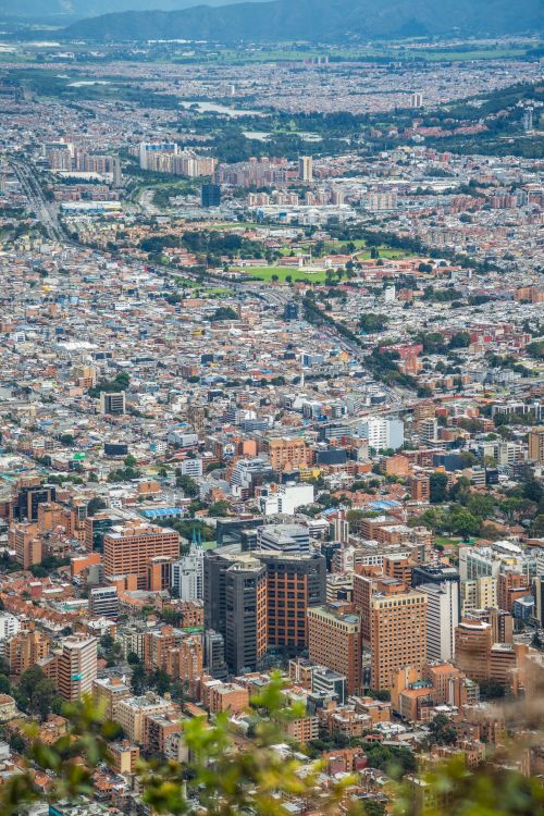 Free An expansive aerial view showcasing the dense urban landscape of Bogotá, Colombia. Stock Photo