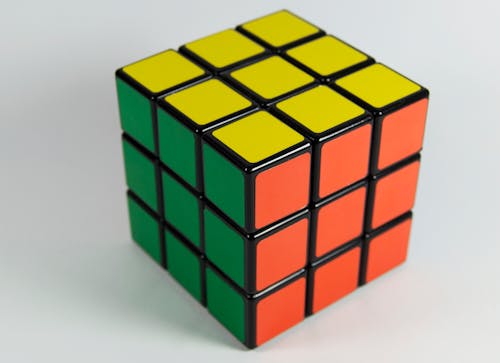 Yellow, Orange, and Green 3x3 Rubik's Cube
