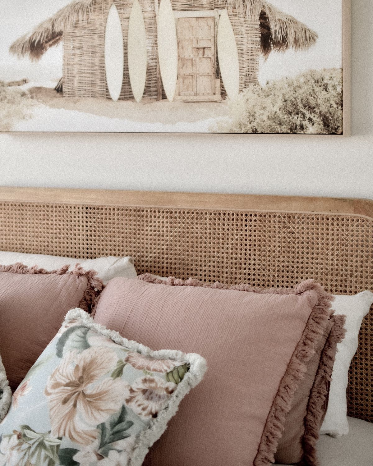 Beach-inspired bedroom with pastel cushions and relaxed coastal decor